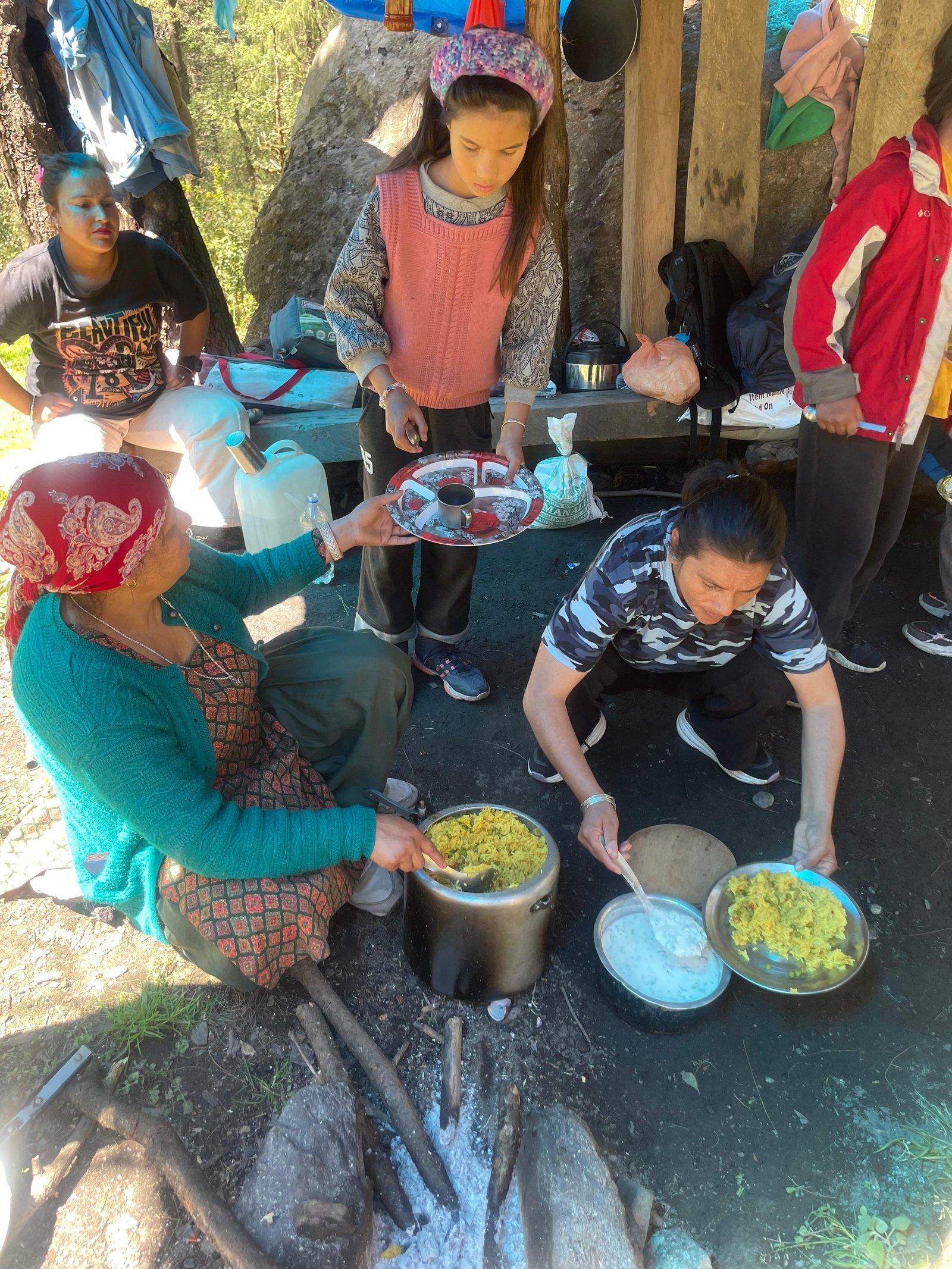 Chef preparing traditional camp woodfire food
